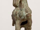 a statue of a horse that is sitting on a table