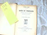 an open book with a yellow sticker on top of it