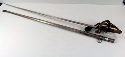 an image of a pair of swords sitting on top of a white table