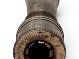 an old gun with a hole in the middle of it
