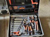many tools in a tool case on the floor