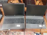 two laptops that are sitting on a table