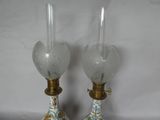 two vases that have been decorated with flowers on them
