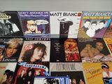 a lot of music cds on the table together