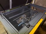 a machine that is sitting inside of a metal box