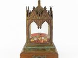 an image of a small wooden shrine with a glass dome on top of it