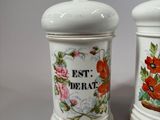 two salt and pepper shakers sitting on a table