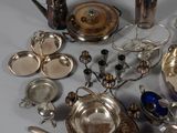 a lot of silver items that are on a table