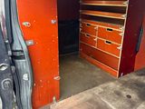 a van that has a bunch of drawers inside of it