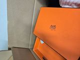 an orange box with a pair of shoes inside of it
