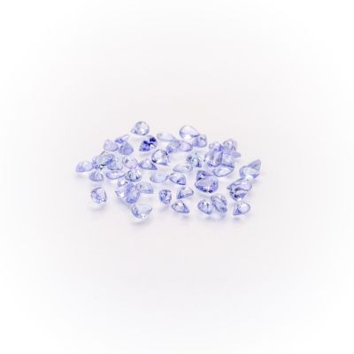 a pile of blue and white diamonds on a white surface
