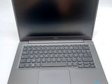 a laptop that is sitting on a white table