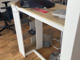 a desk with a monitor and a keyboard on it