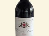 a bottle of wine that is sitting on a table