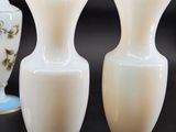 three vases that are sitting on a table