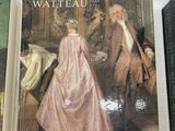 three books on a shelf with a painting of a man and a woman
