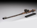 an old gun with a wooden handle on a stand