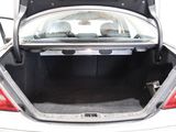 a trunk of a silver car with its trunk open