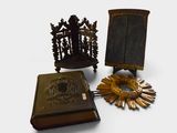 two books and a clock on a table next to a sunflower