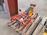 a bike that is sitting on a pallet next to a chair