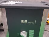 an image of a machine that is sitting on top of a green mat