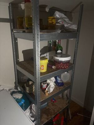 a shelf with various items on it in a room