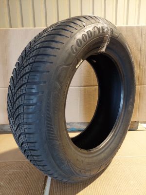 a close up of a tire on a stand in a room