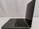 an open laptop computer sitting on top of a white table