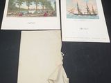two old postcards of ships on a table next to a piece of paper