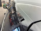 a close up of a car ' s windshield with a sticker on it