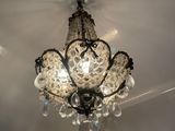 a chandelier hanging from the ceiling in a room