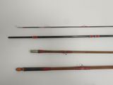 four different types of fishing rods on a white surface