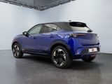 the rear end of a blue toyota c - hr suv parked in a garage