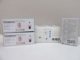 three boxes of baby products sitting on top of a white table