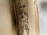 an old book with a picture of a man and a woman on it