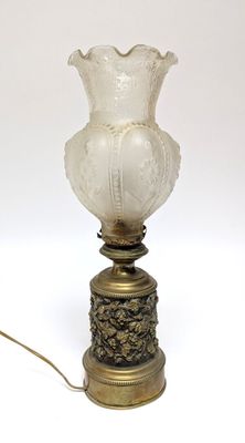 a lamp that is sitting on a table next to a lamp