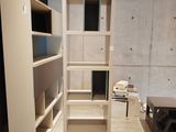 a room with a ladder and a book shelf in it