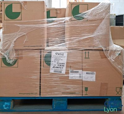 a pallet full of boxes wrapped in plastic