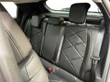 the back seats of a car with a phone holder on the back of it