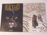 deux livres sur Blackad et Blackad posés sur la table