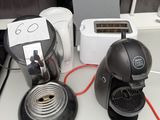a coffee maker, toaster, toaster, toaster and toaster on a counter