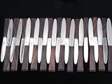 a lot of knives that are sitting on a table