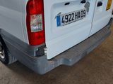 a picture of a white truck parked in a garage