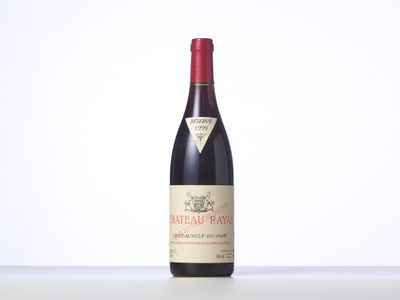 a bottle of red wine sitting on top of a table