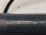 a close up of a bicycle handlebar with a cable