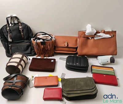 a lot of purses that are sitting on a table