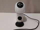 a camera that is sitting on a table next to a mouse