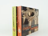 two books sitting on top of each other in front of a white background