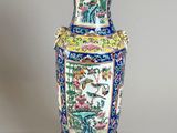 a vase that is sitting on a stand on a table