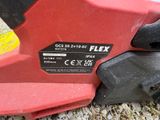 a close up of a red and black power tool